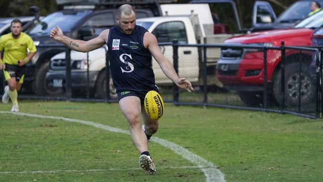 Outer East: Mark Cecere gets a kick for Seville. Picture: Valeriu Campan