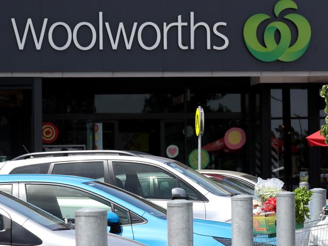 ADELAIDE, AUSTRALIA - NOVEMBER 18: A lady in a mask leaves Woolworths at Wets Torrens on November 18, 2020 in Adelaide, Australia. South Australian premier Steven Marshall has announced new lockdown restrictions across the state for the next six days in response to growing new COVID-19 cases in the community. The new restrictions will come into effect at midnight, with all South Australians required to stay home for the next six days and only able to leave home for essential purposes. People will not be permitted to leave their homes to exercise and only one person per household can visit a supermarket per day. All schools will be shut except for children of essential workers and vulnerable children while childcare will be open only to essential workers. Aged care and residential disability care is in lockdown. Takeaway food outlets, restaurants, bars, cafes, pubs and other food venues will close. Non-essential business and industry will shut down, weddings and funerals will be banned for six days and face masks will be encouraged when outside the home but are not mandatory. (Photo by Kelly Barnes/Getty Images)