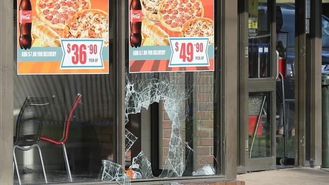 The window of the Corio Fish and Chip and Pizza shop was smashed. Picture: Alan Barber