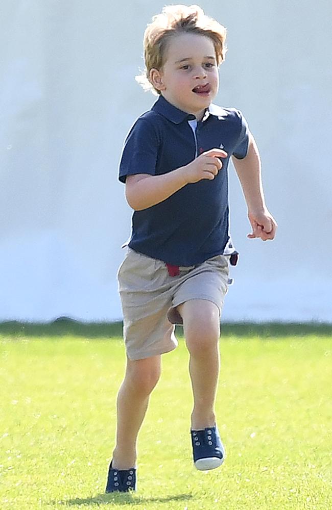 Prince George plays outside as his father Prince William plays polo. Picture: James Whatling/Mega