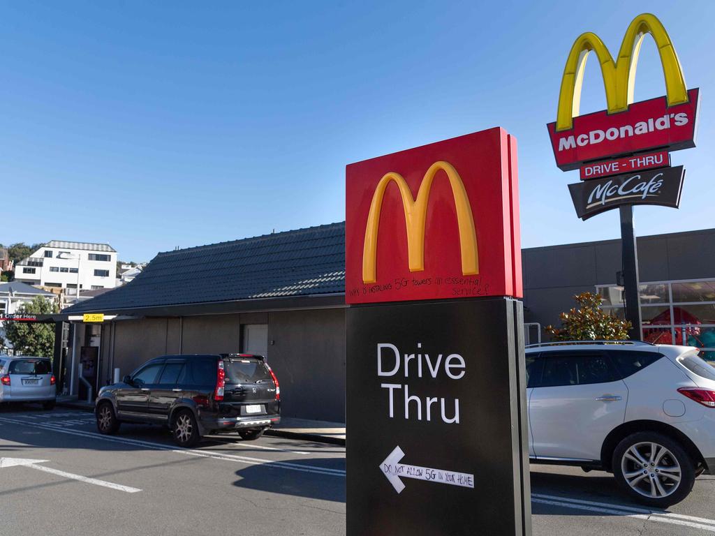 Customers queue up for the "drive-thru" at a McDonald's restaurant on the first day of the easing of restrictions in Wellington on April 28, 2020, following the COVID-19 coronavirus outbreak. - New Zealanders satisfied their cravings for hamburgers and coffee as a five-week lockdown eased on April 28, amid hopes the South Pacific nation has the coronavirus under control. (Photo by Marty MELVILLE / AFP)