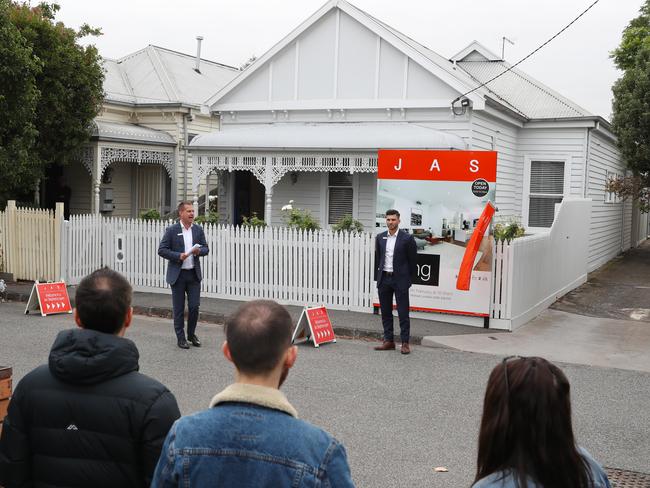 Tate Moore auctioneer. Seddon couple Tam and Anthony Bulloch, who abandoned plans to sell their home as Melbourne's tough, weeks long stage-four lockdown tanked the city's property market have sold their home today. Saturday, FEBRUARY 27, 2021. Picture: David Crosling