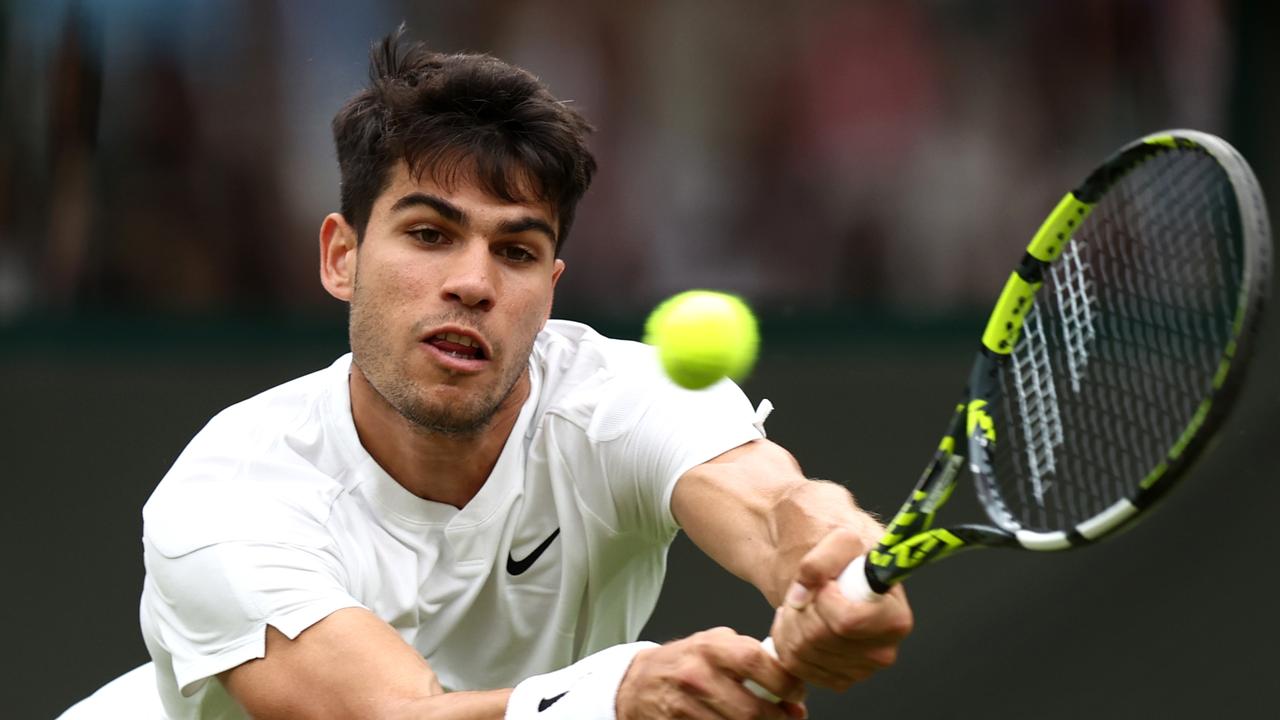 Carlos Alcaraz of Spain plays a backhand against Aleksandar Vukic of Australia. (Photo by Francois Nel/Getty Images)