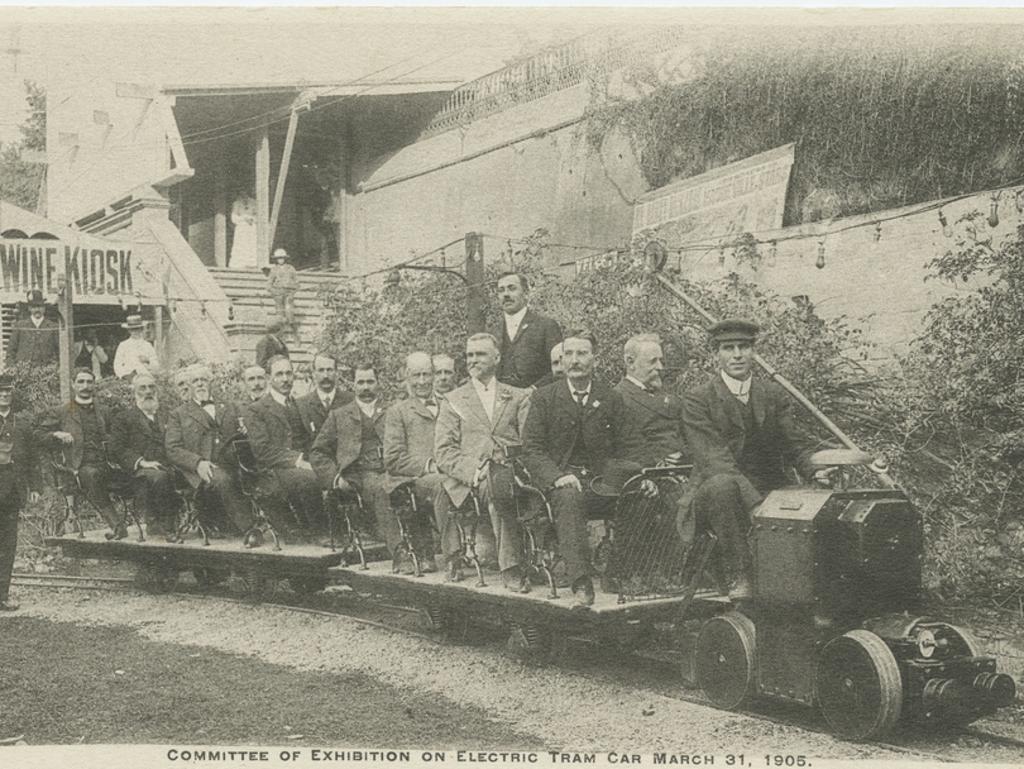 Members of the committee organising the exhibition of the new electric tram car held on March 31 1905 enjoying a ride on a miniature tram set up in the grounds at the rear of the Exhibition Building on North Terrace, Adelaide.