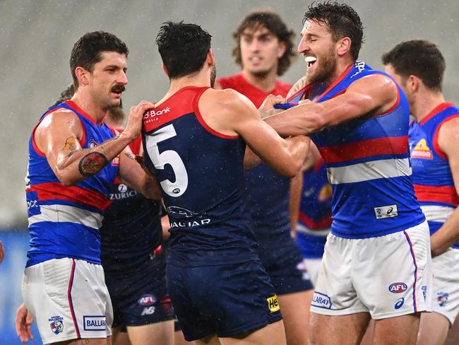 Christian Petracca of the Demons and Marcus Bontempelli of the Bulldogs get in a wrestle. Picture: Quinn Rooney/Getty Images