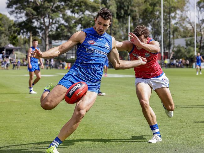 Luke Davies-Uniacke drills a kick forward. Picture: Ian Currie