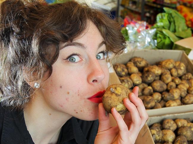 The Foodstore staff member Steffi Koppelmann gets excited about the first delivery of South Arm Pink Eye Potatoes for the season.