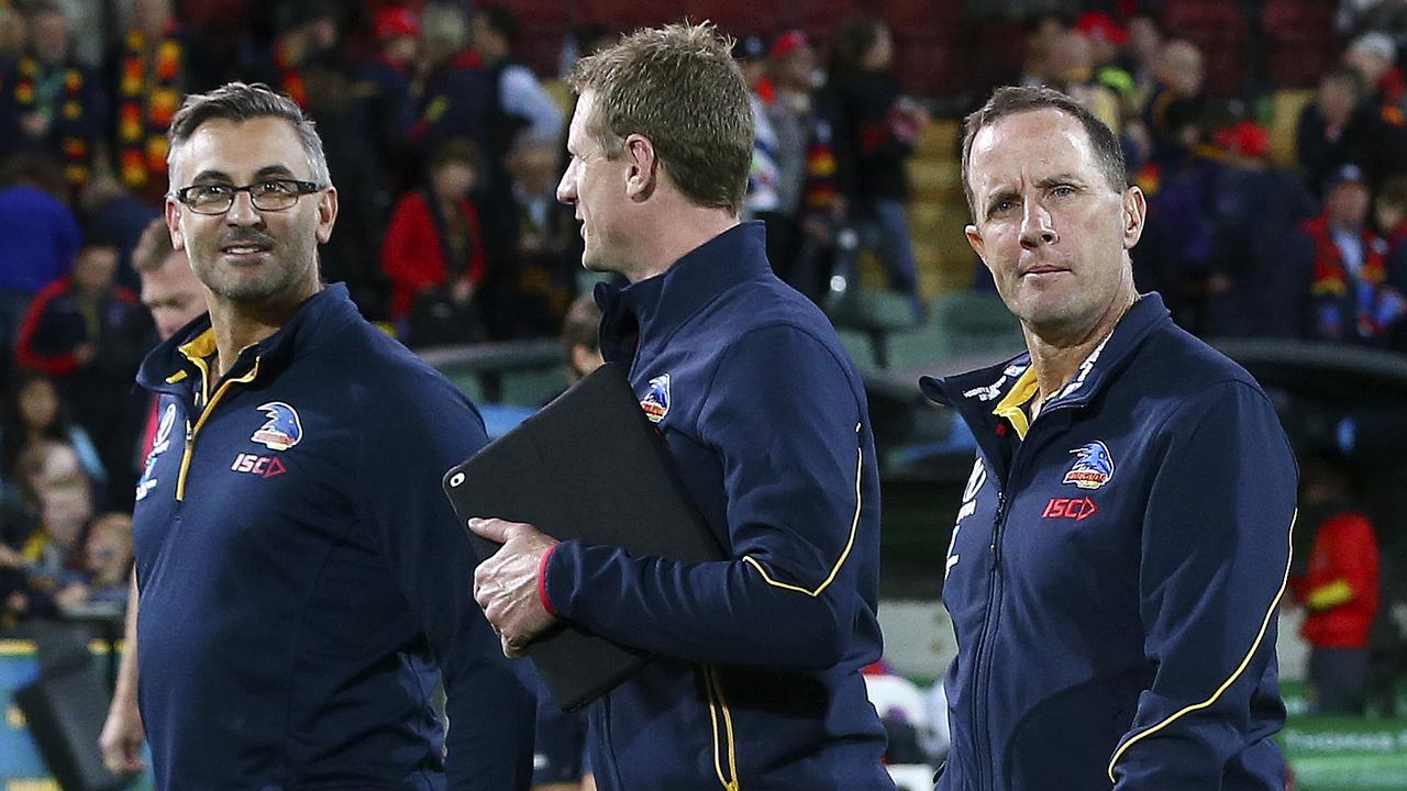 28/04/18 - AFL - Round 6 - Adelaide Crows v Gold Coast Suns at the Adelaide Oval. Don Pyke and his coaching team Scott Camporeale and Brett Burton walk off after the win. Picture SARAH REED