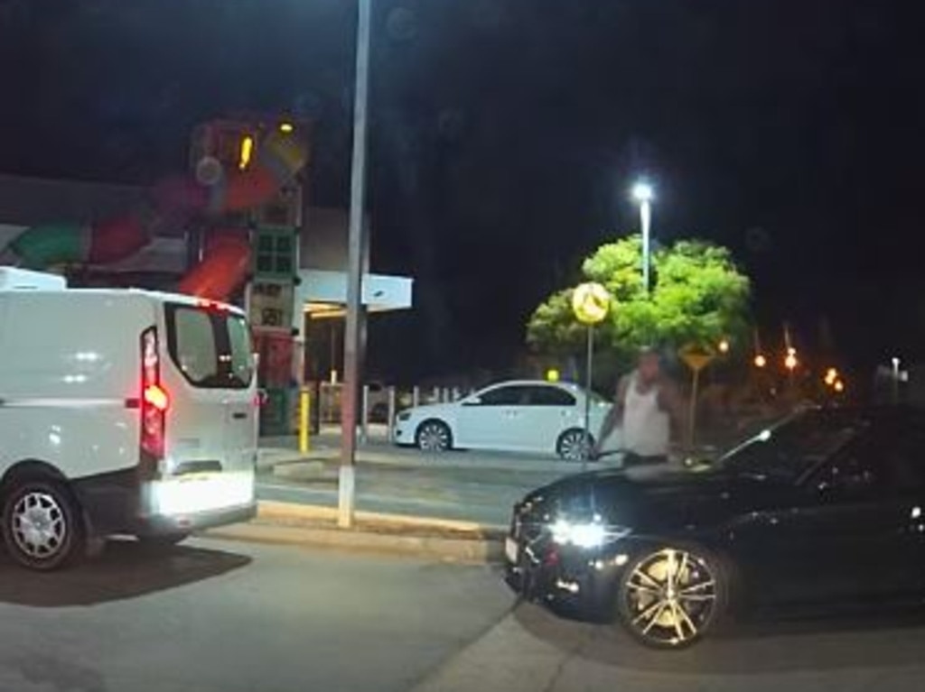 While his girlfriend is inside the restaurant, her burly boyfriend makes his way over to the back car. Picture: Facebook