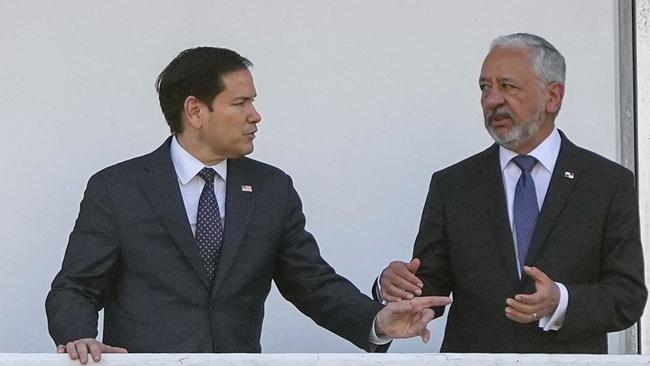 Marco Rubio, left, talks to Panama Canal Authority Administrator Ricaurte Vasquez on Sunday during a tour at the Miraflores locks of the canal. Picture: AFP