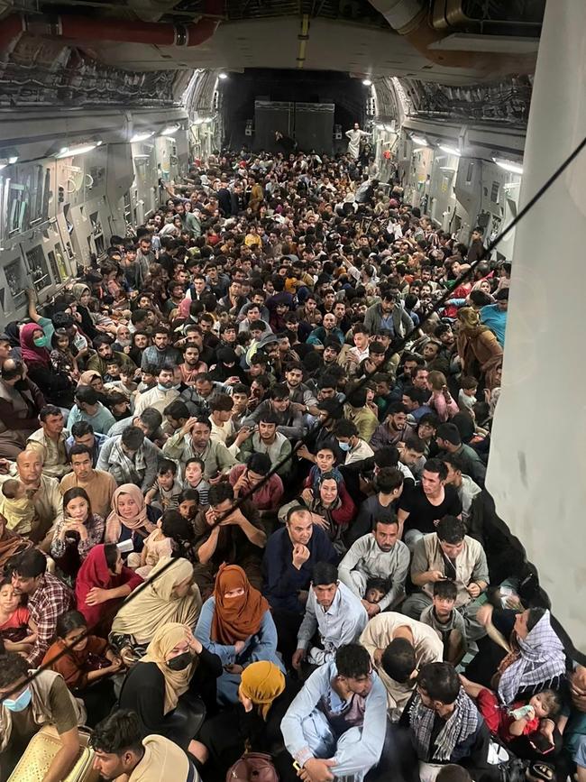 About 640 Afghan evacuees on a US Air Force transport aircraft bound for Qatar on Tuesday. Picture: AFP