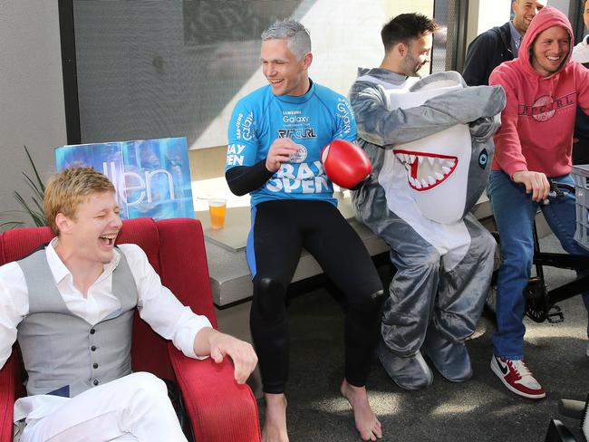 George Horlin-Smith as Ellen DeGeneres, Joel Selwood, Jimmy Bartel and James Kelly as Elliott from ET. Picture: Mike Dugdale