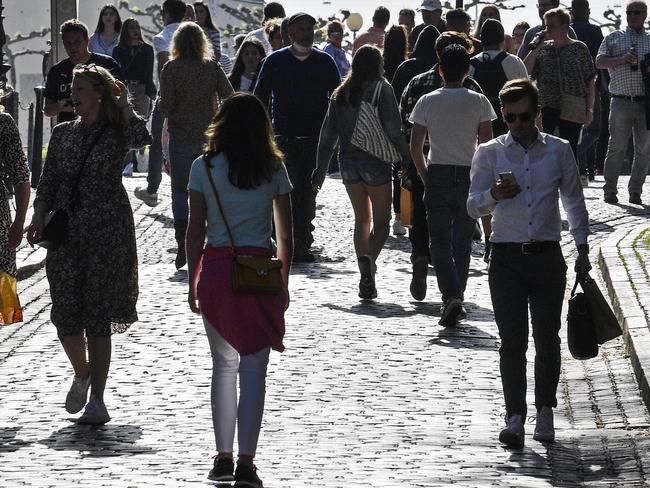 A lot of people enjoy the evening sun in Duesseldorf, Germany, despite the social distancing order. Picture: AP