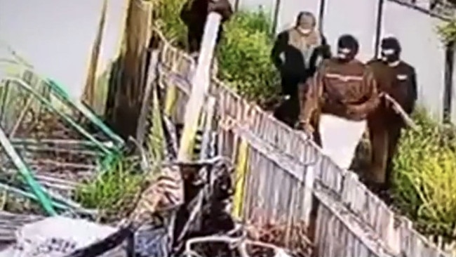 CCTV of masked gunmen who peppered the front yard of a home on Goldingham St, Tenambit on October 16, 2022 where Maddison Hickson was staying. Picture: Channel 7