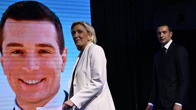 French far-right Rassemblement National (RN) party leader Marine Le Pen (L) and party President Jordan Bardella address supporters. Picture: AFP.