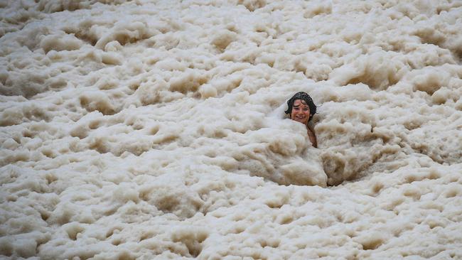 Foam washes up at Froggy Beach on the Gold Coast. Picture: NIGEL HALLETT