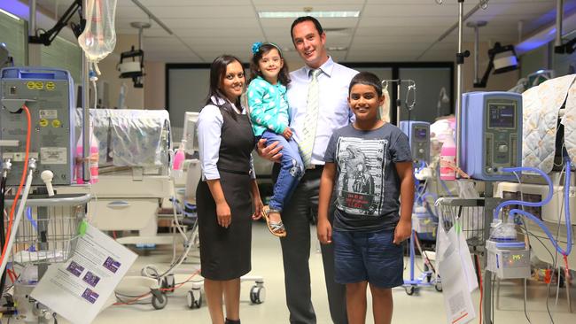 Naz and Chris Spicer with children Mikael and Isabelle at the neonatal unit at Nepean Hospital.