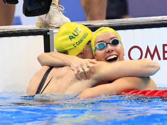 BEST 25....... Emma McKeon wins Gold in the Women's 100m Freestyle Final at the Tokyo Aquatic Centre during the Tokyo 2020 Olympics. She celebrates with Bronze medallist Cate Campbell. Pics Adam Head
