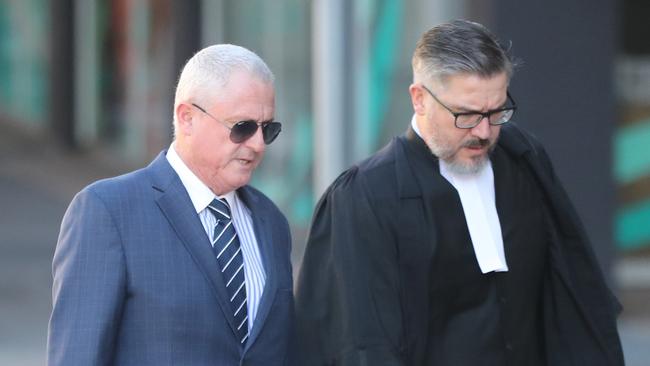 Craig Gore (left) with a barrister.