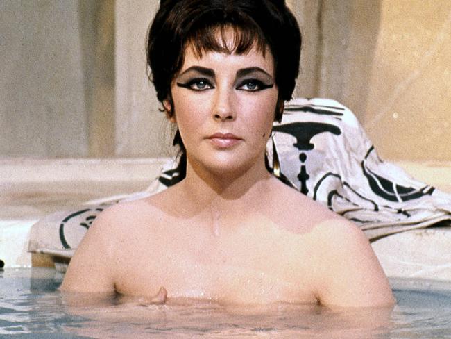 Elizabeth Taylor (1932-2011), British actress, bathing with the water at chest height in a publicity still issued for the film, 'Cleopatra', 1963. The historical drama, directed by Joseph L. Mankiewicz (1909?1993), starred Taylor as 'Cleopatra'. (Photo by Silver Screen Collection/Getty Images)