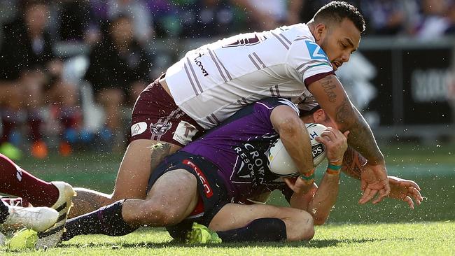 Cooper Cronk taken high by Addin Fonua-Blake.