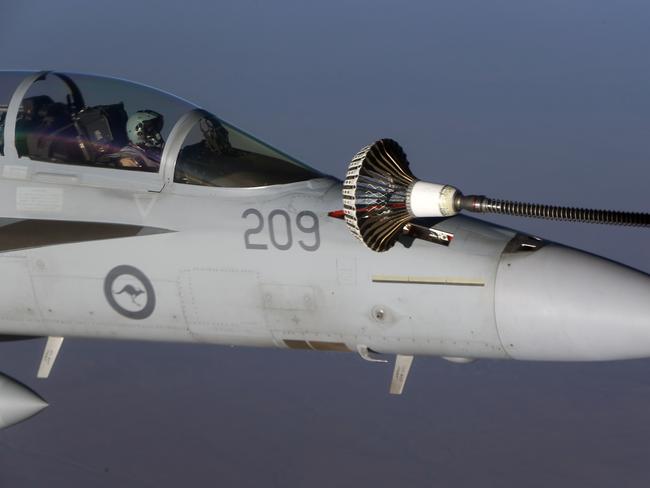 On a mission ...Royal Australian Air Force F/A18F Super Hornets and one RAAF KC-30A Refueler over northern Iraq. Picture: Gary Ramage