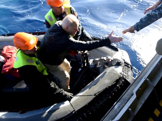 The survivors were rescued a full day after the yacht capsized. Picture: AFP