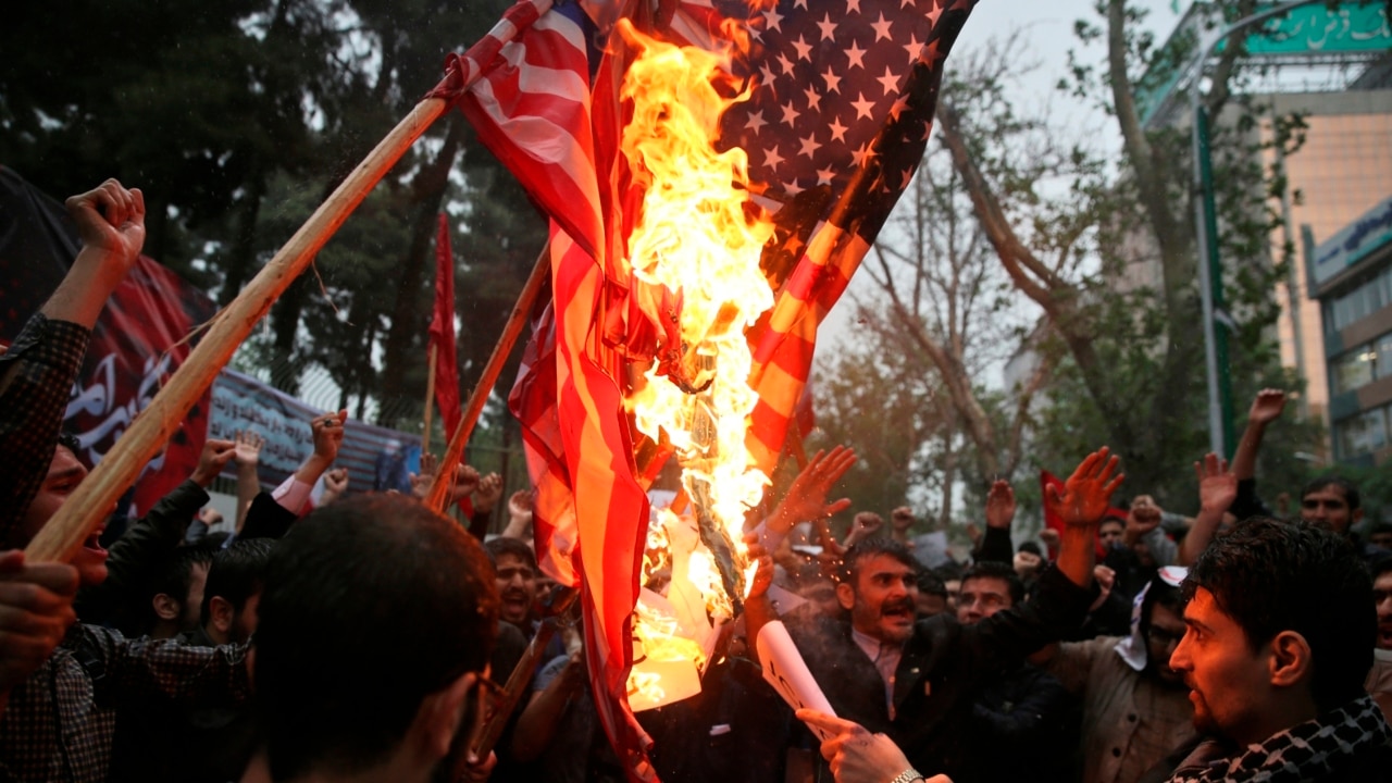 Iranians burn US flags in response to Trump's sanctions