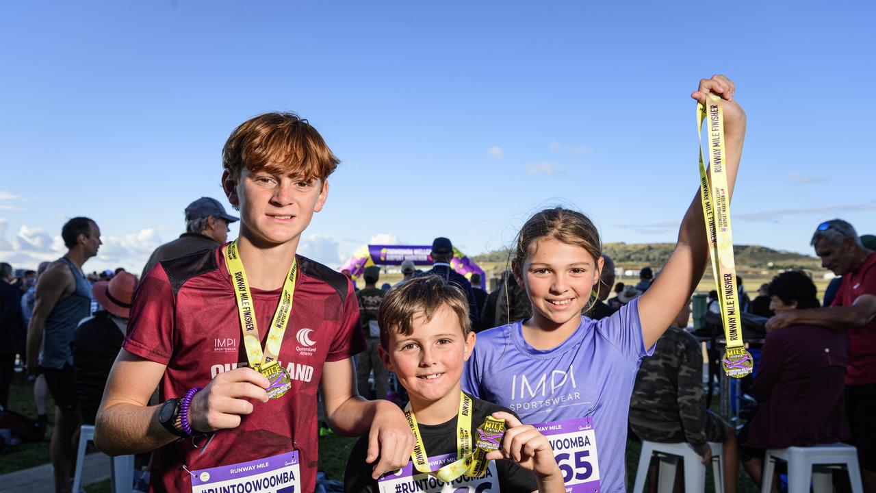 Siblings (from left) Nazarlo, Rymiko and Ceharliah Larkin with their Runway Mile finisher medals at the Toowoomba Marathon events at Wellcamp Airport, Saturday, May 3, 2025. Picture: Kevin Farmer