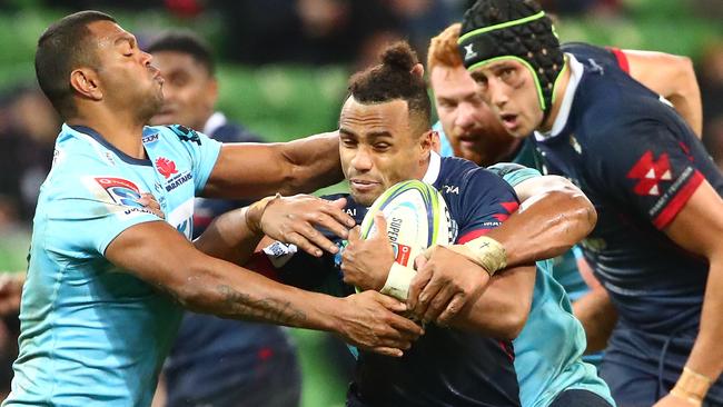 MELBOURNE, AUSTRALIA - MAY 31: Will Genia of the Rebels is tackled by Kurtley Beale of the Waratahs during the round 16 Super Rugby match between the Rebels and the Waratahs at AAMI Park on May 31, 2019 in Melbourne, Australia. (Photo by Scott Barbour/Getty Images)