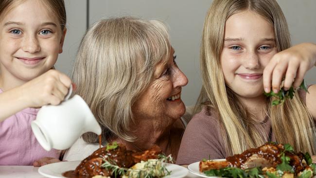 Lamb shanks are back on the menu for Sheila and her grandchildren Felicity, 8 and Phoebe, 11. Photo by Martin Keep/Coles
