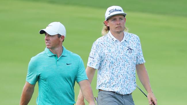 Rory McIlroy (left) and Cameron Smith walk up the 18th fairway at East Lake Golf Club during a PGA Tour event last August. Picture: Getty Images