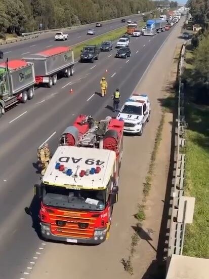 Debris along Princes Fwy in Werribee where the crane of a truck collided with a bridge. Picture: 9News
