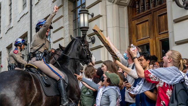 Mounted police work to contain demonstrators at the University of Texas at Austin on Wednesday. Students walked out of class as protests over Gaza continue to sweep college campuses around the country. Picture: AFP