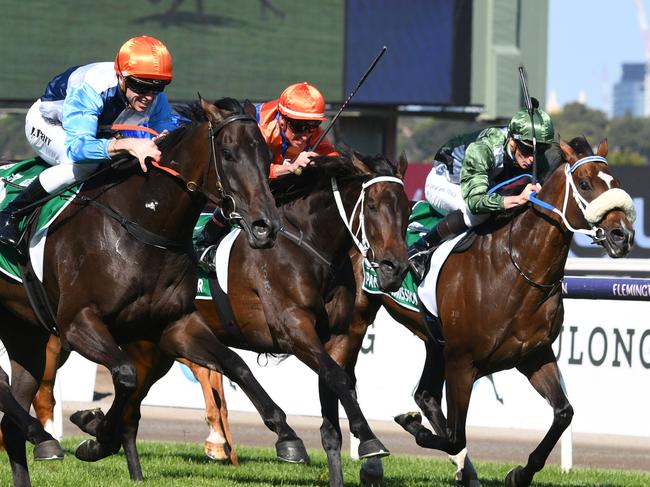 MELBOURNE, AUSTRALIA - MARCH 12: Josh Parr riding Duais defeat Think it Over and Spanish Mission in Race 7, the Tab Australian Cup, during Melbourne Racing at Flemington Racecourse on March 12, 2022 in Melbourne, Australia. (Photo by Vince Caligiuri/Getty Images)