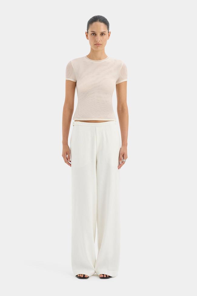 Sir.Dorian Wide Leg PantThe soft ivory shade on these low rise, linen-viscose blend pants from Sir. has us dreaming of the beach and long lunches, but are versatile enough to be worn in a work environment also. Simply pop on a white tank top, black blazer and mules, and you’re in business—literally.Type: Pants | Material: Linen, viscose, rayon | Colour: White, black | Delivery: Free over $300Shop now for $420
