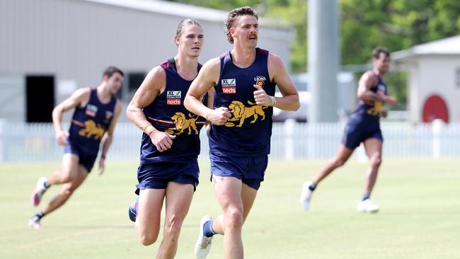 Daniher and Hipwood run laps together at Brisbane training. Picture: Tara Croser