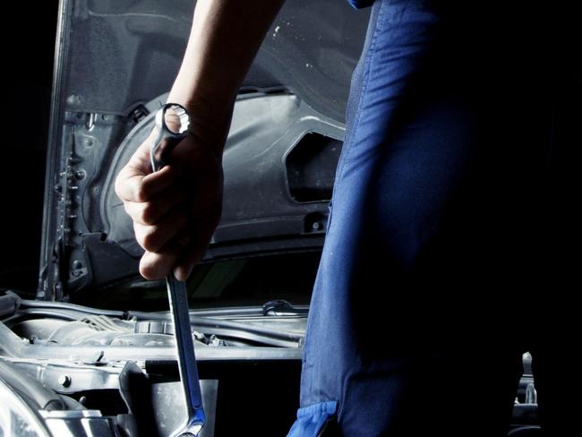 Generic Thinkstock image of serviceman car mechanic with motor car.