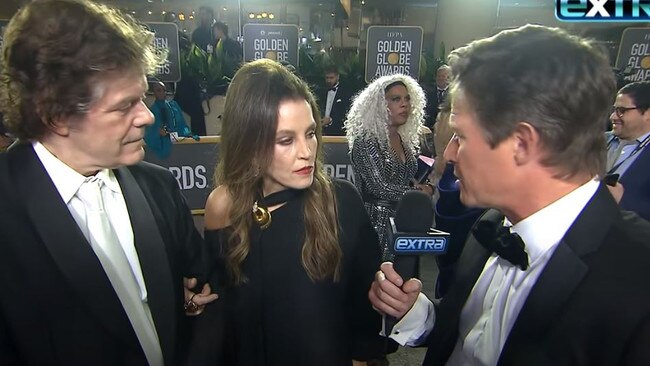 Lisa Marie Presley interviewed by Billy Bush (right) at the Golden Globes.