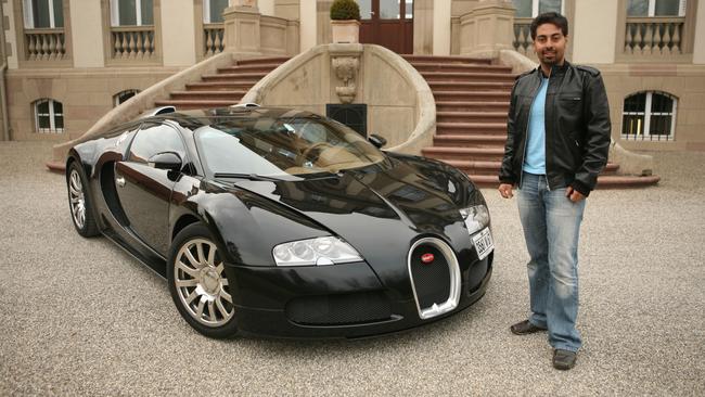 Website founder Alborz Fallah with a Bugatti Veyron, the world’s fastest car. Picture: Supplied.