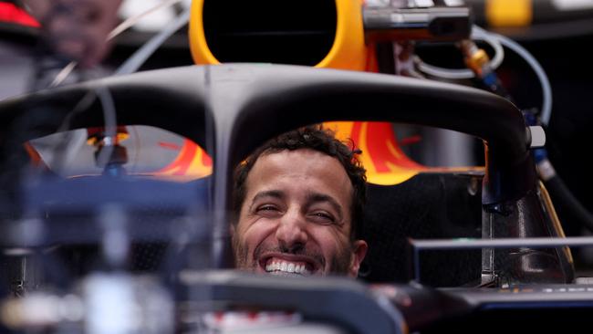 The man with 1000 smiles soaks up the atmosphere in the Red Bull garage. Picture: AFP