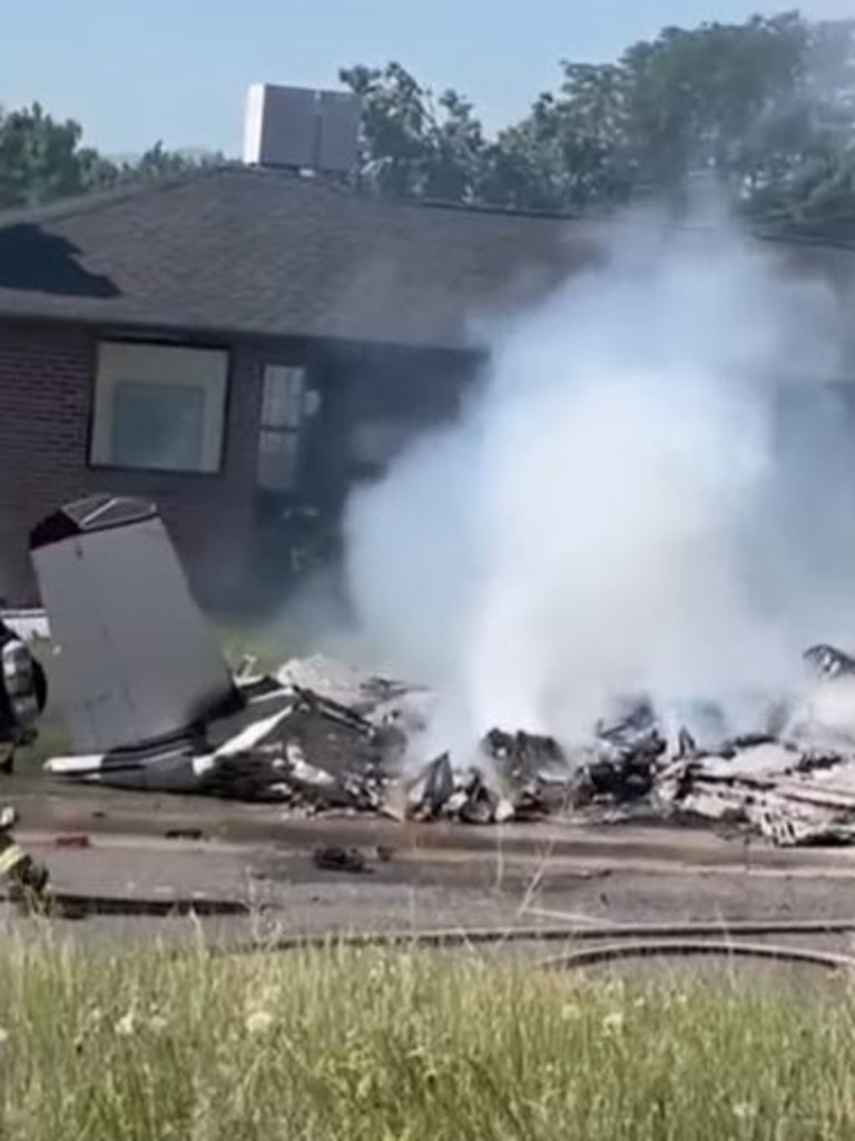 Plane crashes in front yard of US home, as two kids pulled from ...