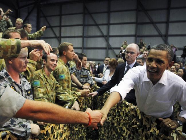 President Barack Obama met Australian troops during a visit to the Royal Australian Air Force base in Darwin in 2011. The trip had a second important purpose. Picture: Charles Dharapak/AP