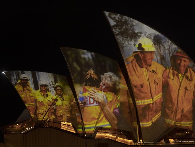 Images of firefighters projected on the sails of Sydney Opera House. Picture: Brook Mitchell/Getty Images