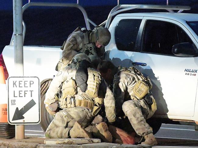 Ben Hoffmann is held down by police after he allegedly killed four people and injured one in Darwin CBD, Tuesday, June 4, 2019. Picture: Keri Megelus