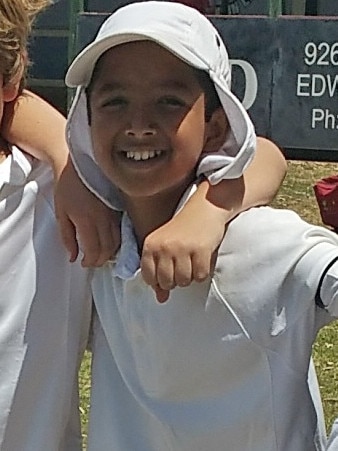 A young Vinuka Jayasinghe after a primary school cricket match. Picture supplied