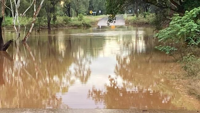 Flood waters at the creek crossing 400m from Clermont Veterinary Surgery on Laglan Road, Clermont, on Friday. Picture: Clermont Veterinary Surgery