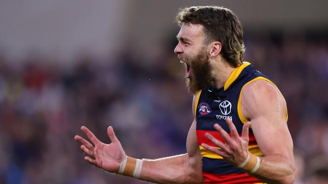 ADELAIDE, AUSTRALIA - AUG 11: Riley Thilthorpe of the Crows celebrates a goal during the 2024 AFL Round 22 match between the Adelaide Crows and the Western Bulldogs at Adelaide Oval on August 11, 2024 in Adelaide, Australia. (Photo by Sarah Reed/AFL Photos via Getty Images)