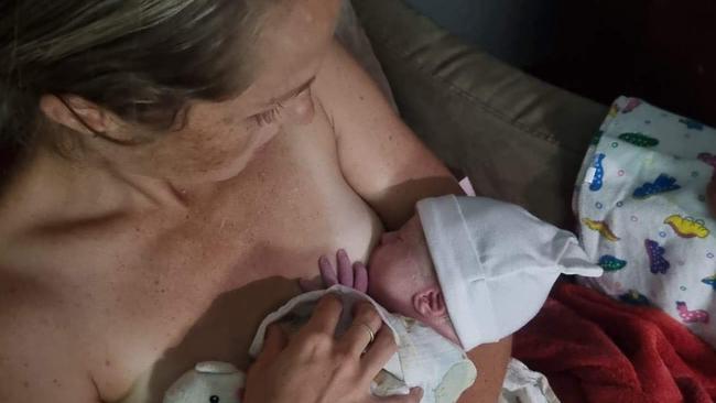 Cooktown resident Jen Pope shortly after giving birth at her hone in 2022 after the Cooktown Hospital closed it's birthing unit. Picture: Supplied