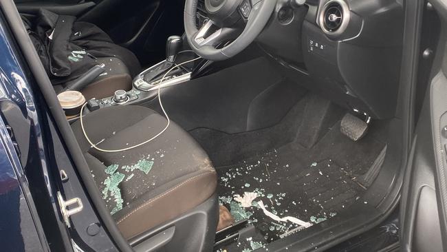 The driver’s window was smashed after a violent attempted carjacking.